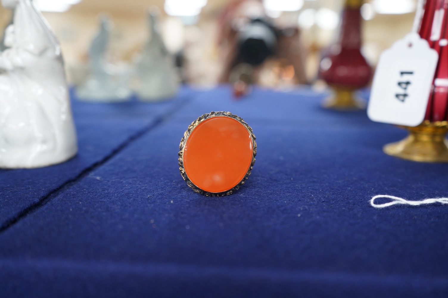 A 19th century French? gilt white metal, coral and multi gem-set table seal, modelled as a gentleman attacking a serpent with an axe, on a rustic gem set oval base, inset with carnelian, 93mm. Condition - poor